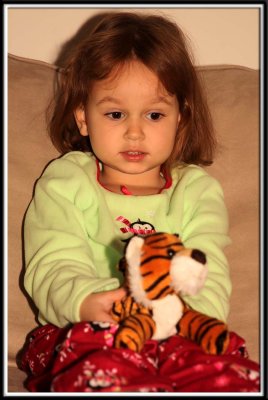 Kylie gets a stuffed tiger from Noelle