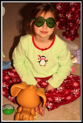 Noelle tries on the swimming puppy's goggles
