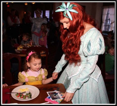 Kylie asks Ariel to sign her postcard