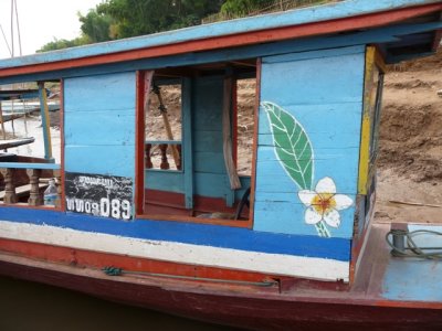 Mekong riverboat with Lao floral emblem