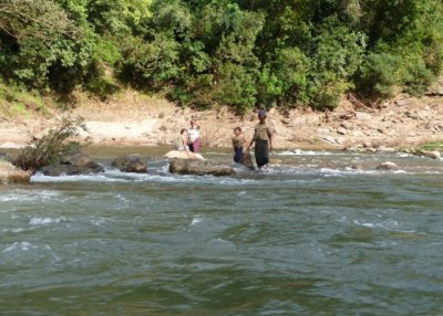 Women bathing at rapids