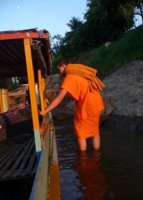 Monk disembarks near temple