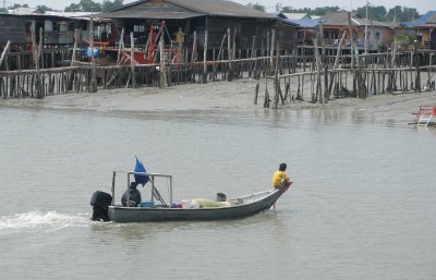 Returning boat with small boy, Pulau Ketam