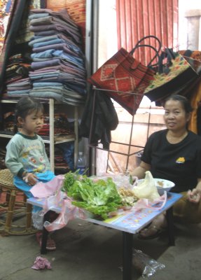 Stallholder having meal, Hmong market