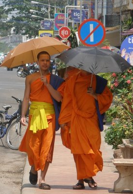 Monks in city street