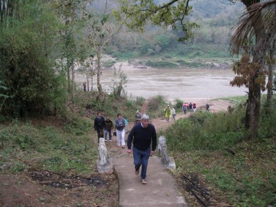 Walking up the riverbank to visit a village