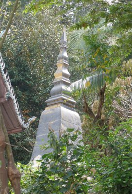 Stupa in the jungle on lower slopes of Phou Si