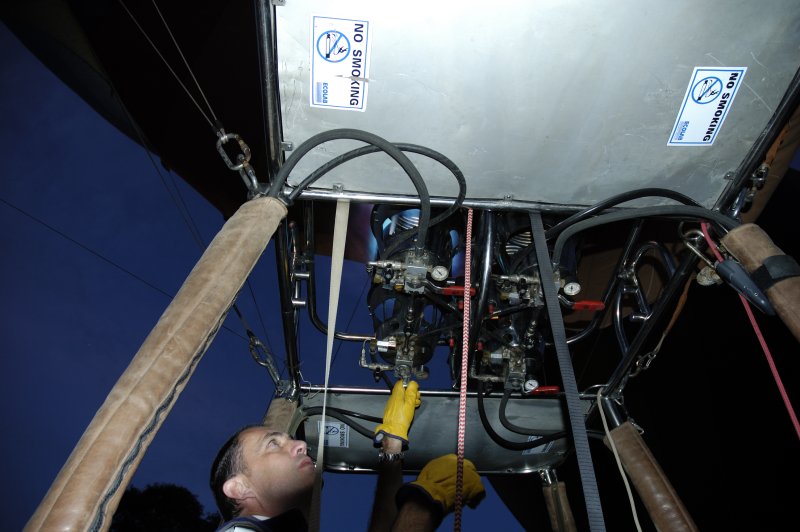 The pilot adjusts the gauges