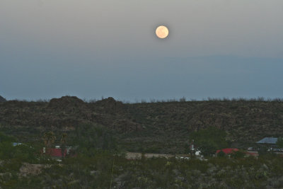 as the moon rises over Big Bend Ranch.