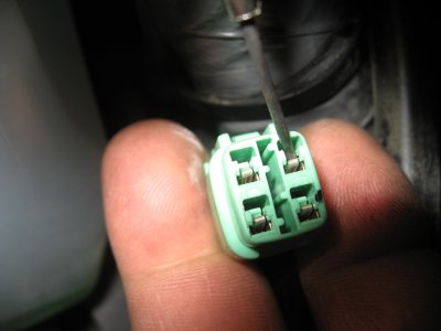 Releasing the locking tab for the connector pin