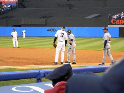 Shelley Duncan chats with Pudge Rodriguez while Andy Van Slyke looks on