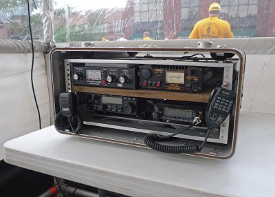 THE COMMAND UNIT HAS MANY WAYS TO COMMUNICATE WITH VOLUNTEER WORKERS, INCLUDING THIS BANK OF RADIOS