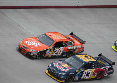 TONY STEWART PASSES BRIAN VICKERS ON THE OUTSIDE