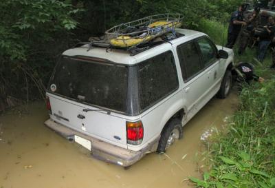 Minivan stuck in mud