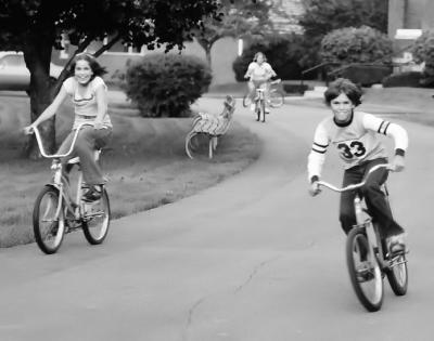 Boy and Girl Ride Bikes