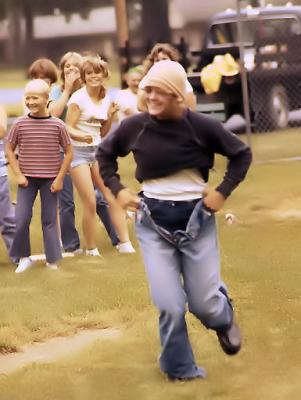 Girl in baggy clothes relay race