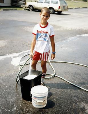 Boy Prepares for Car Wash