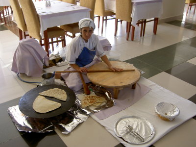Preparing bazlama (Turkish flat bread) for hotel guests