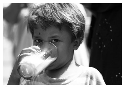 Child drinking sugar cane juice