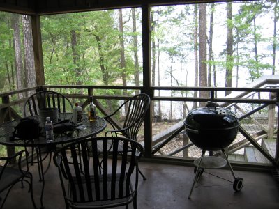 Dining room towards the lake at the screened in porch