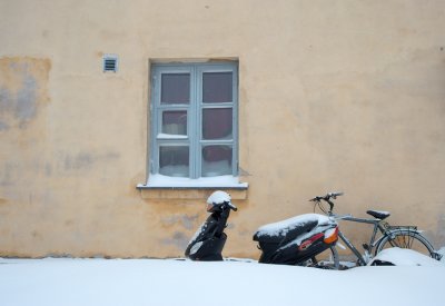 A window, bike and scooter