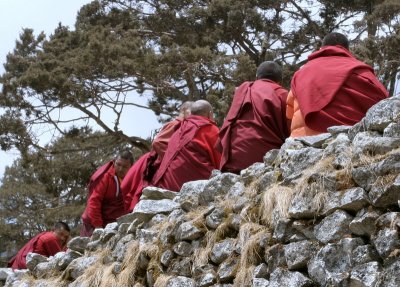 Monks on a wall at Khumjung Monastery
