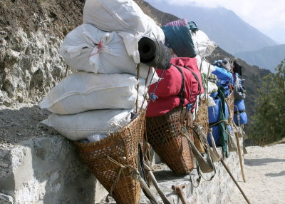 Loads by the trail as porters take a break.