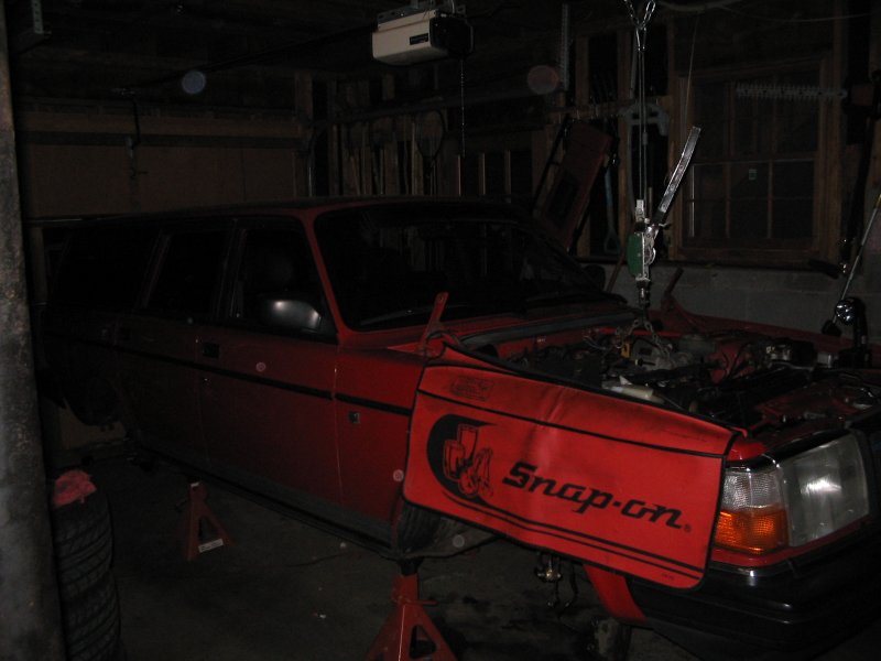 Supporting the motor so I could drop the front cross member & the oil pan to drill the return hole in the block