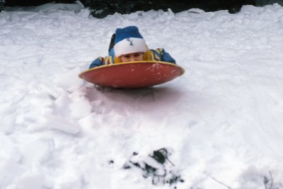 Jonathan and Brian Gibbons sledding February 1982