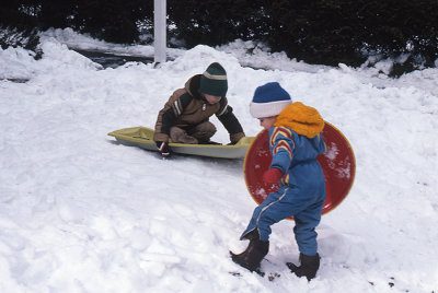 Jonathan and Brian Gibbons sledding February 1982