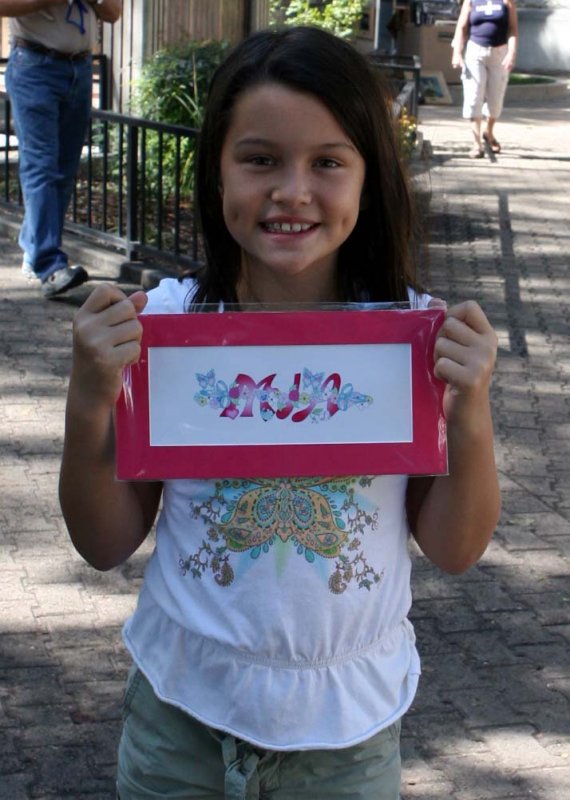 Mia and her sign.jpg