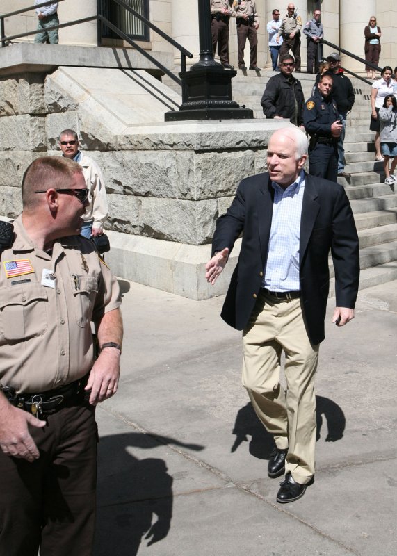 John McCain reaches out to an officer