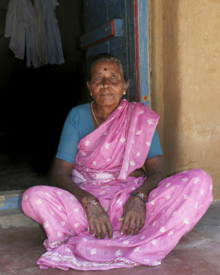 grounded Hindu woman at her home