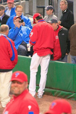 Hamels signing some autographs