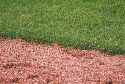 Warning track and grass