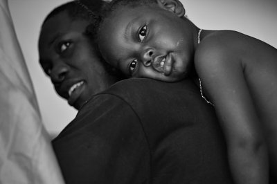 Father and Child at Tent Entrance