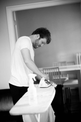 Ironing his shirt