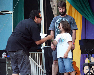 Ten-year-old stage hand helps the crew