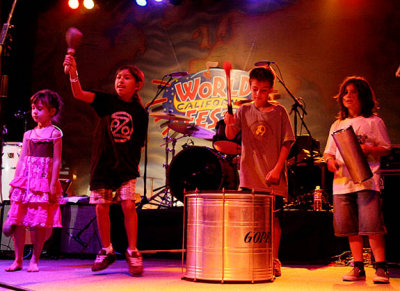 Youngsters invited onstage with Ozomatli