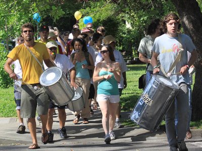 Drummers lead the walk down Fourth Street
