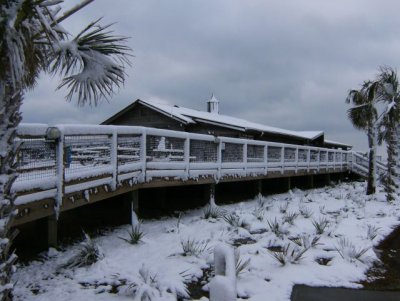 Snow on the shop and the boardwalk