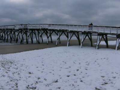 Snow on the beach and pier