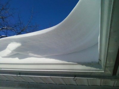 Big wave of snow above the deck