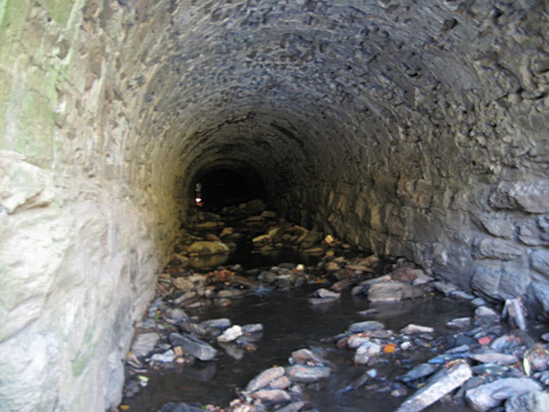 Tumbled stone floor, rough walls