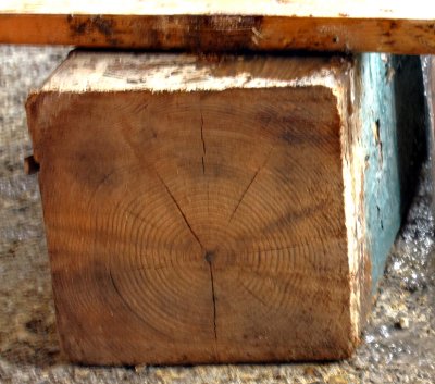 The old post was turned from the center of a single log.