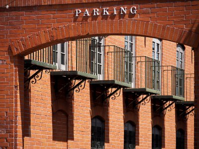 Parking Sign on Brick Wall