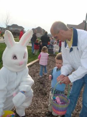 with the easter bunny (last time he saw one he was terrified- this time was so-so)
