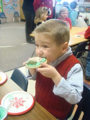 having a little cookie with his sprinkles
