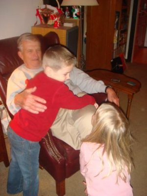 kids hug grandpa