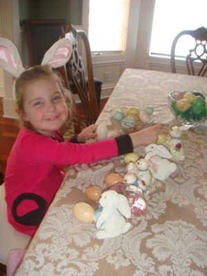 playing with easter decorations- another favorite holiday of elisabeth's
